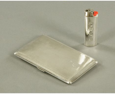 A silver cigarette case, engine turned, Birmingham 1945, maker e. Scott &amp; Co., 214 grams, and a silver lighter case, Birm