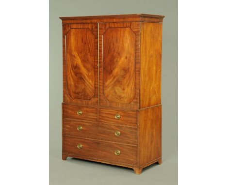 A George III mahogany gentleman's press, with moulded cornice above a pair of doors opening to hanging space, the base conver