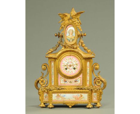 A late 19th century French gilt spelter and Paris porcelain mounted mantle clock, surmounted by lovebirds amongst blossoms in