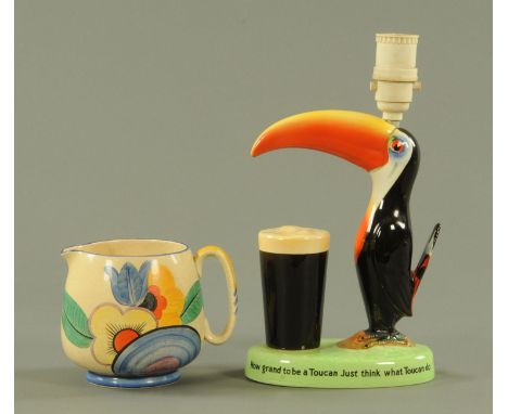 A Carltonware "Guinness" advertising table lamp, together with a Crown Devon Fielding's Art Deco jug pattern A198.  23 cm and