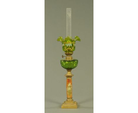 A 19th century French green glass oil lamp, with wavy frill shade with enamel floral decoration with gilt ribbons above the f