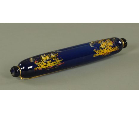A 19th century Bristol glass rolling pin, with printed decoration of two ships titled "Homewards Bound", 38.5 cm long.