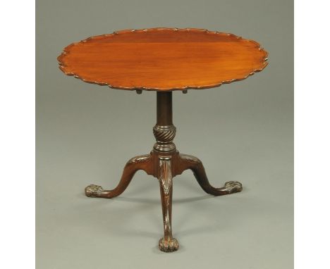 A 19th century mahogany tripod table with piecrust edge, snap action, turned column and legs terminating in claw and ball fee