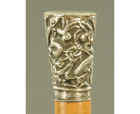 A Chinese silver mounted malacca walking stick, late 19th century, the silver mount embossed with entwining dragons amongst c