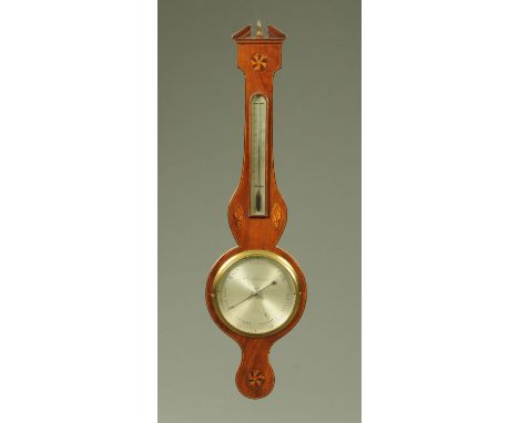 A 19th century inlaid mahogany banjo barometer, by Lombardini, London.  Height 97 cm (see illustration). 