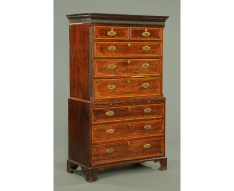 A George III mahogany tallboy, with dentil cornice above two short and three long graduated drawers with brass drop handles w