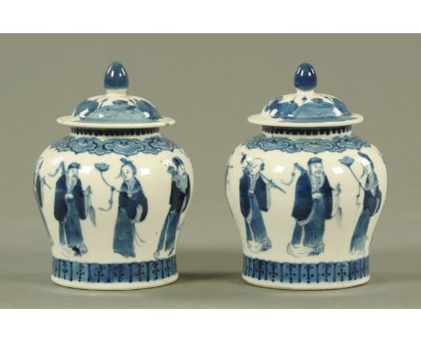 A pair of Chinese blue and white vases and covers, 19th century, each of inverted baluster form decorated with eight immortal