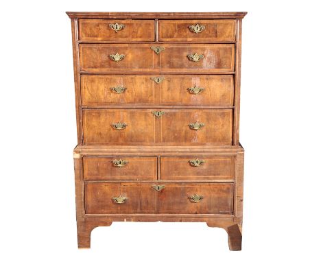 A QUEEN ANNE WALNUT CHEST ON CHESTthe upper section with a moulded cornice over two short and three long graduated drawers, t