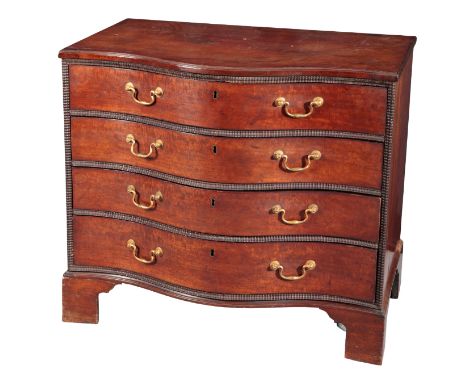 A GEORGE III MAHOGANY SERPENTINE CHEST OF DRAWERSthe four graduated drawers set within moulded surrounds, on shaped bracket f