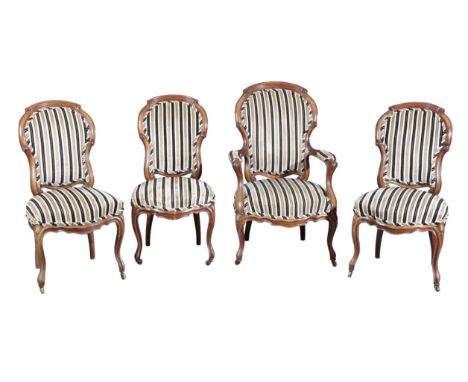 A SET OF FOUR DANISH MAHOGANY SALON CHAIRS19th century, with spoon backs and shaped arms on cabriole front legs and castors, 