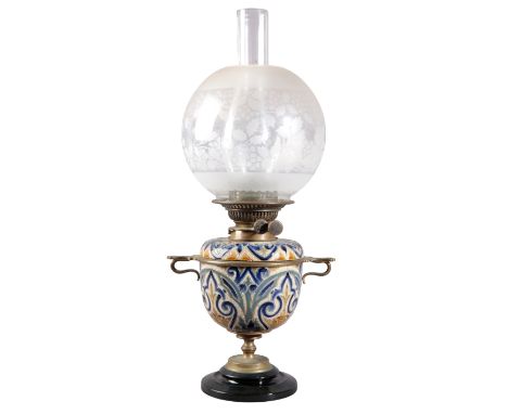 A DOULTON LAMBETH STONEWARE OIL LAMP OF ARTS AND CRAFTS DESIGN the bulbous body decorated by Edith Lupton, with blue, green a