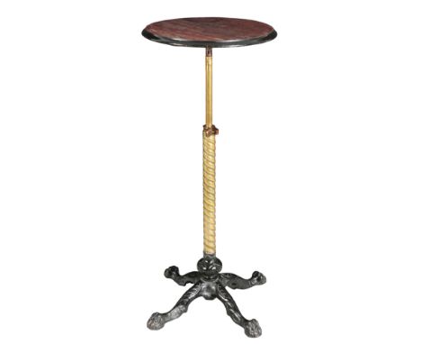 A VICTORIAN MAHOGANY TELESCOPIC WINE TABLEon adjustable polished brass and ebonised metal base, with four paw feet, 85cm high
