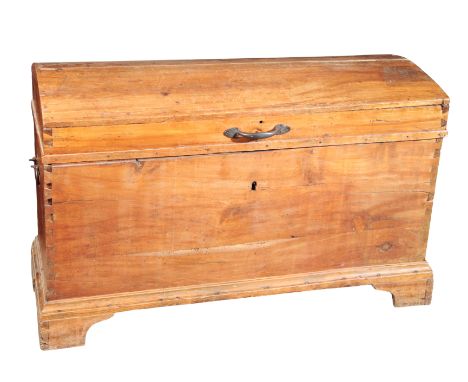 A CONTINENTAL FRUITWOOD COFFER 19th century, the domed top opening to an interior fitted with a small box, brass swing handle