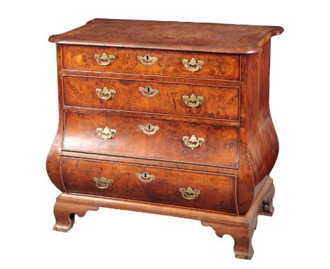 A DUTCH WALNUT BOMBE CHEST OF DRAWERS 18th century, the shaped top over four graduated drawers, on ogee bracket feet, 80cm hi