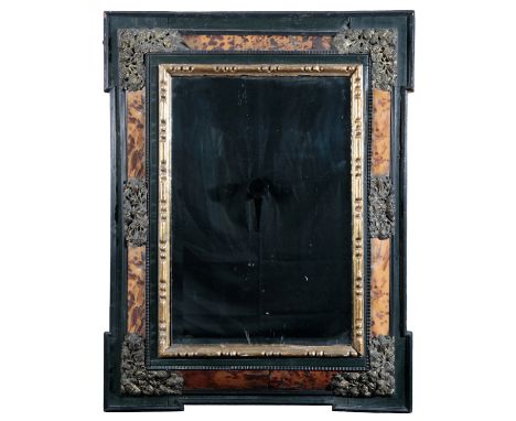 AN EBONISED, SIMULATED WOOD AND PARCEL-GILT CUSHION MIRROR20th century, the rectangular bevelled plate within a moulded surro