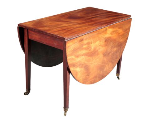 A MAHOGANY SUPPER TABLE 19th century, the drop-flap oval ends on tapered block gate legs terminating in brass toes and castor