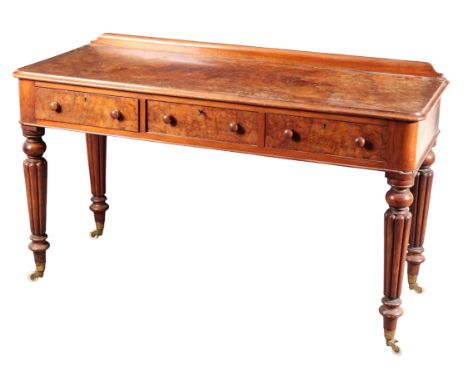 A VICTORIAN WALNUT SIDE TABLE the rectangular top with a moulded edge and a raised gallery back over three frieze drawers, on