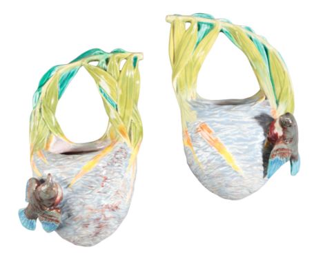 A PAIR OF ROYAL WORCESTER MAJOLICA 'BIRD'S NEST' WALL POCKETS 19th century, each modelled with single birds and nests suspend