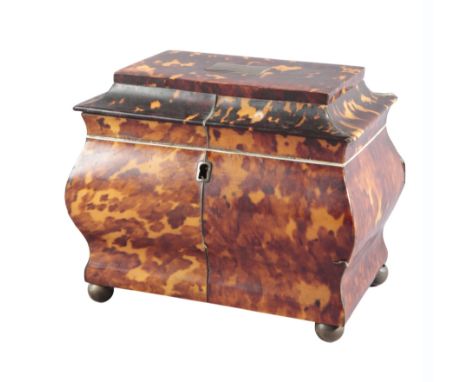 A TORTOISESHELL TEA CADDY 19th century, the shaped lid with a white metal engraved cartouche opening to reveal an interior fi