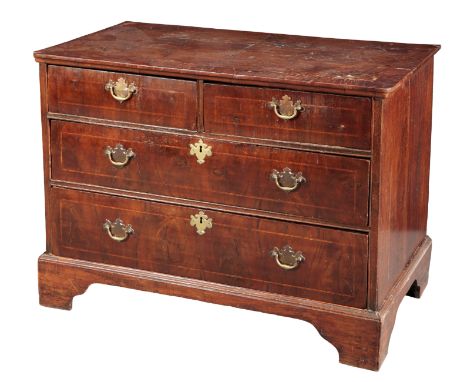 A QUEEN ANNE WALNUT CHEST OF DRAWERSthe rectangular crossbanded top over two short and two long graduated drawers, on shaped 