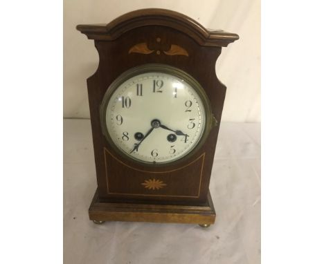 A Victorian inlaid mantel clock