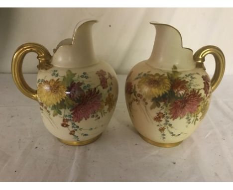 A pair of Royal Worcester jugs