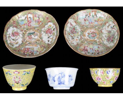 A collection of Chinese enamelled cups & saucers:To include: two 19th-century Canton famille rose saucers richly decorated wi