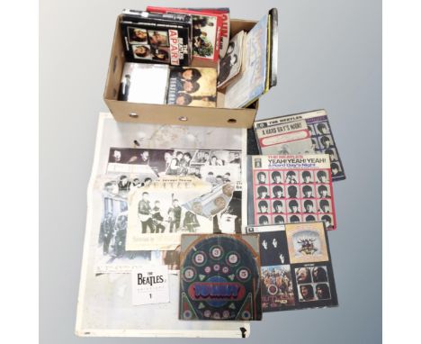 A box of Beatles poster and books, small quantity of vinyl records, The Beatles, John Lennon, Bruce Springstein, The Rolling 