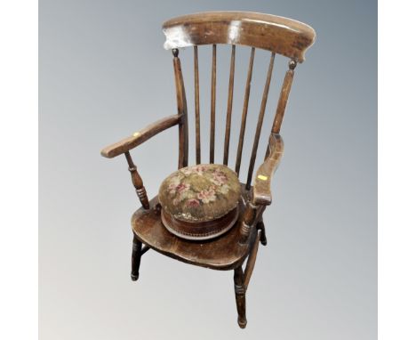 An antique kitchen spindle backed chair together with a Victorian tapestry stool 