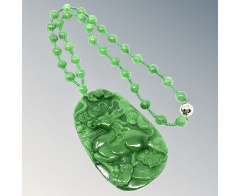 A large good quality jade pendant and necklace 