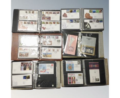A box of six albums of First Day covers, bag of loose stamps, 