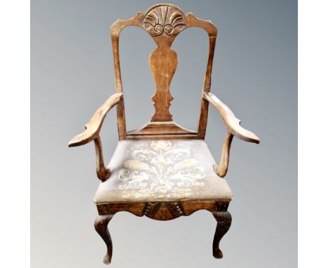 A 19th century elm and beech armchair with tapestry seat 