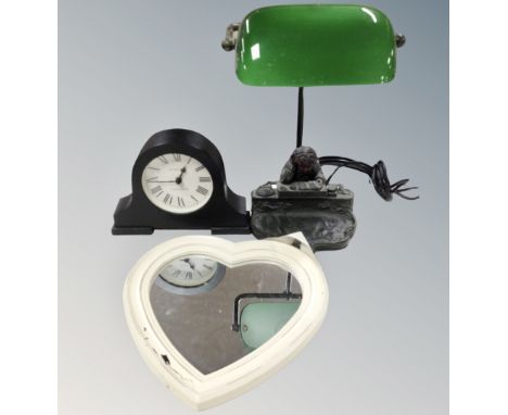 A contemporary figural banker's lamp together with heart shaped mirror and mantel clock 
