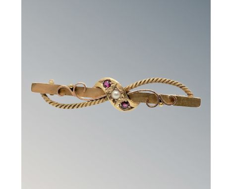 A 15ct gold ruby and pearl bar brooch CONDITION REPORT: 3.3g
