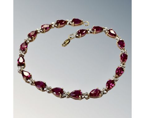 A gold simulated ruby bracelet  CONDITION REPORT: 7.7g