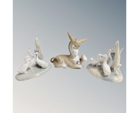 A Lladro figure of a Donkey with flower together with two Nao duck groups 