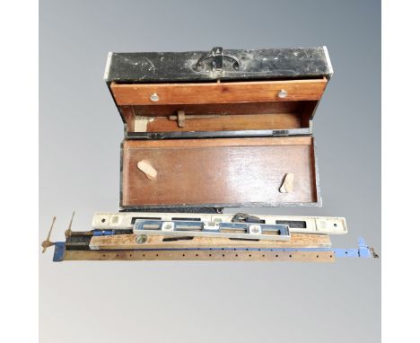 A joiner's tool box together with spirit levels, sash clamps etc 