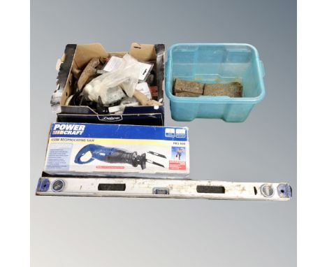 A Powercraft reciprocating saw, boxed, together with two boxes of spirit level, metal wedges, garden tools 