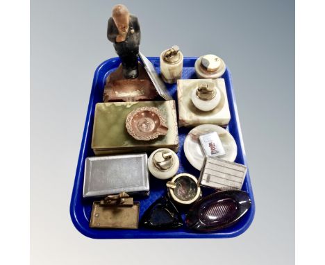 A tray of smoking related items, chalk Churchill figural ashtray, onyx table lighter, ashtray, metal cigarette cases etc 