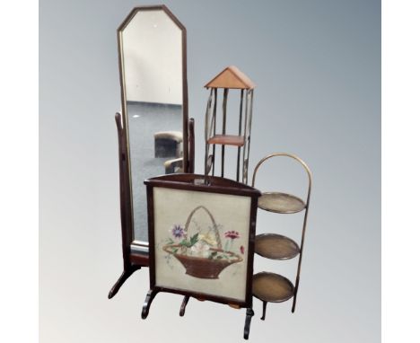 A cheval mirror on stand in mahogany finish together with fire screen, three tier metal cake stand, wood and metal four tier 