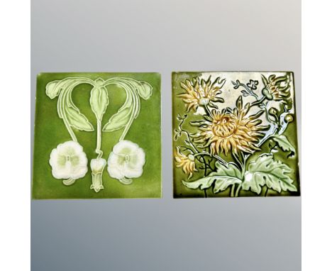 Two late Victorian Arts &amp; Crafts movement ceramic tiles, on green ground, each 15.5cm². (2)