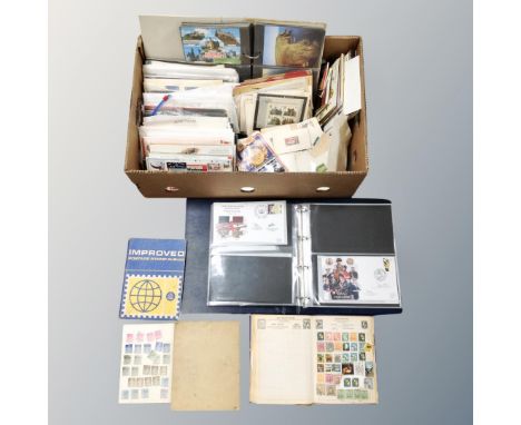 A box of 20th century stamp albums, world stamps, postcards, first day covers, loose stamps, Matchbox bus, postcard packs, al