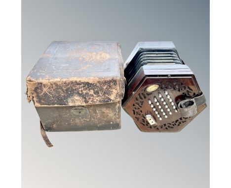 An early 20th century 24-button concertina, possibly by Lachenal &amp; Co, lacks maker's label to rosewood fretwork end piece