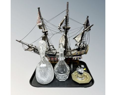 A tray of wooden galleon model, antique glass decanters, Dunhill table lighter in the form of a tankard, octagonal brass dish