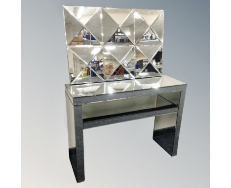 An all glass two tier console table together with further all glass sectional bevelled mirror 