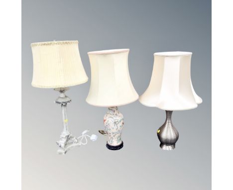 A Chinese style porcelain table lamp on wooden base together with two further contemporary table lamps 