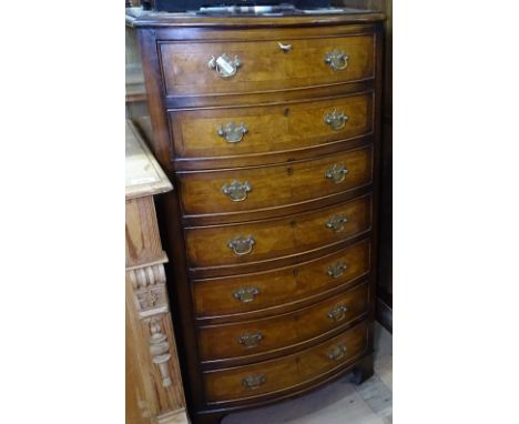 A crossbanded walnut bow-front chest of 7 short drawers on bracket feet, W56cm, H107cm 