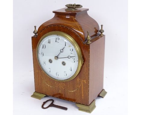 A 19th century mahogany 8-day bracket clock, marquetry inlaid swag decoration with brass mounts and shaped case, with white e