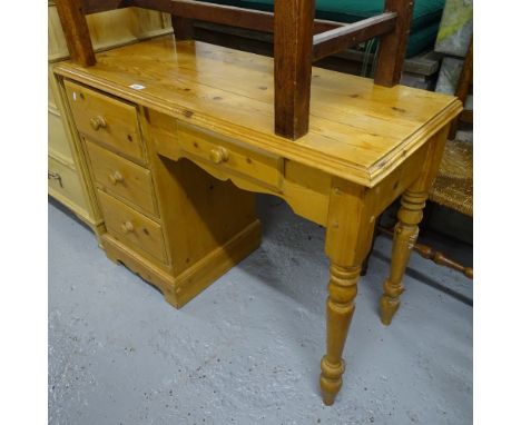 A pine single pedestal writing desk with fitted drawers, W100cm 