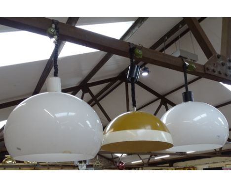 A pair of Italian mid-century Guzzini ceiling light shades, diameter 42cm, and another 